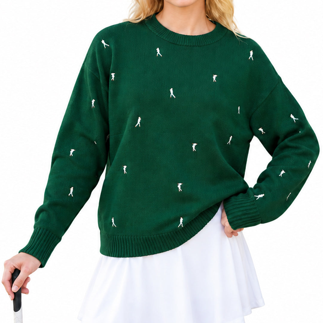 Model wearing a dark green knit sweater with small embroidered golf motifs