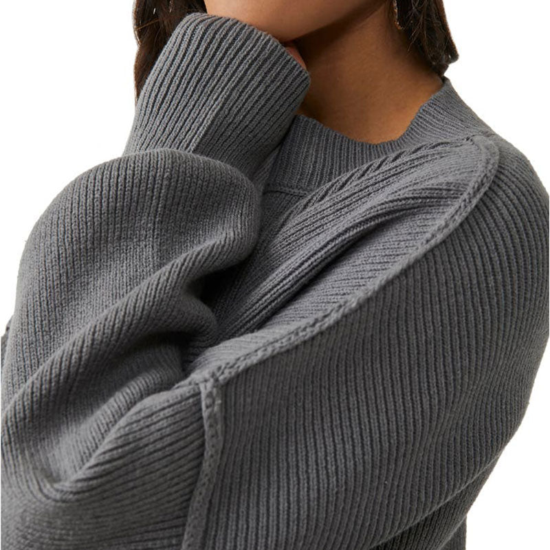 Close-up of the sleeve and texture of a custom wholesale cotton blend solid crew neck knit pullover sweater in grey