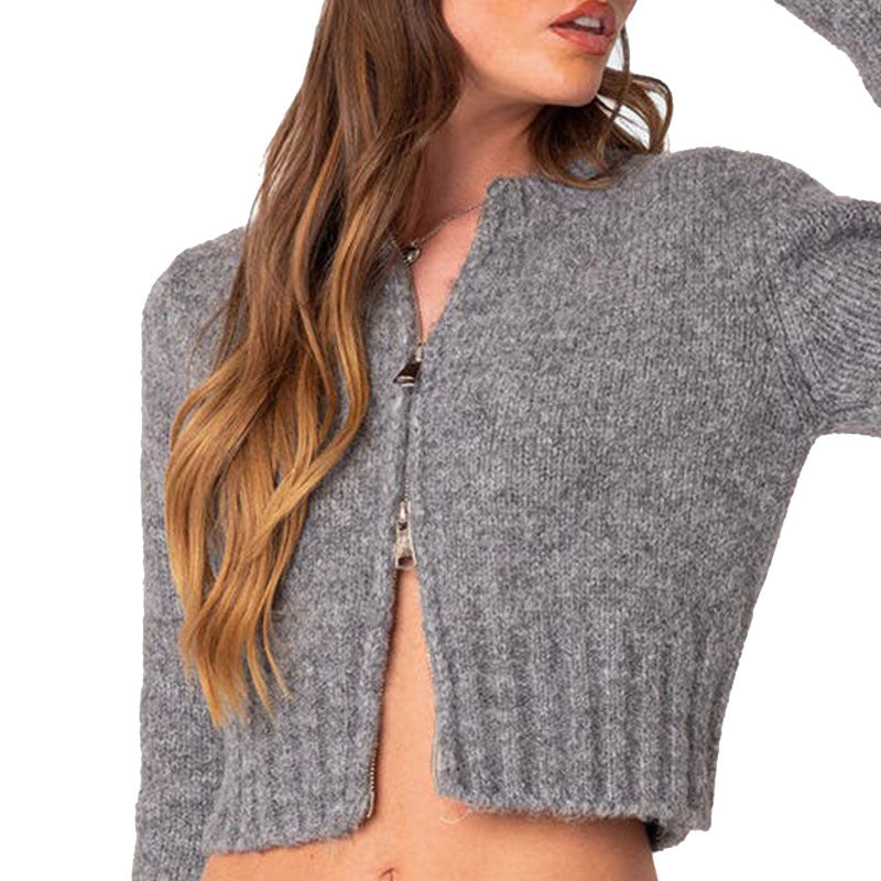 Close-up of a custom gray knit sweater with a zipper, focusing on the detailed knit texture.