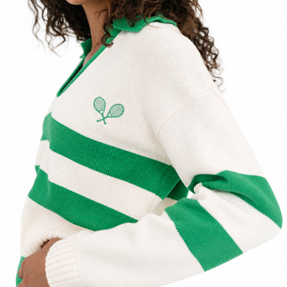 Close-up of green striped sleeves on a white women's knit cardigan