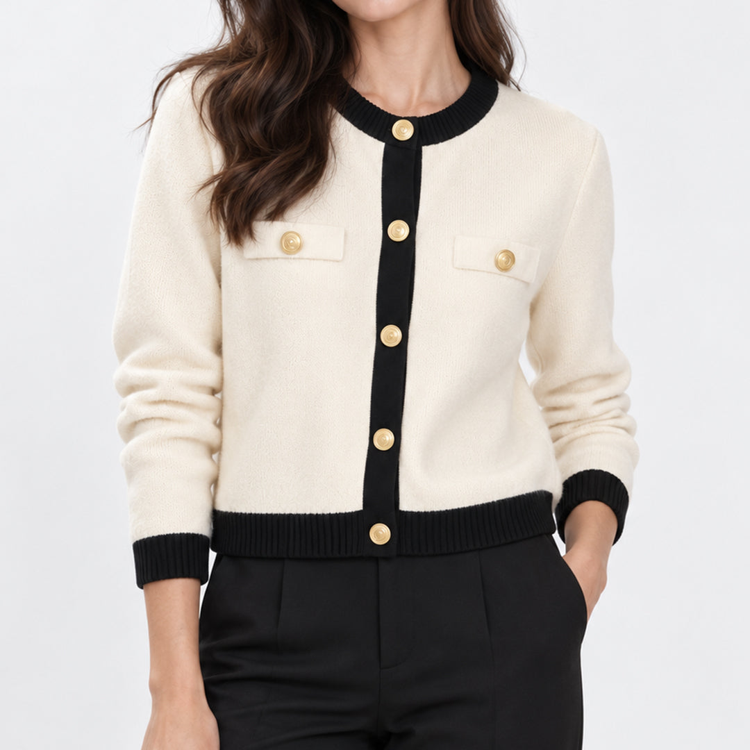 Cream knit cardigan with black contrast trim and gold-tone buttons