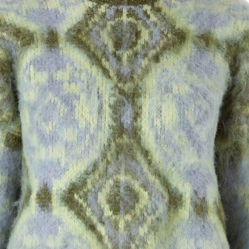 Close-up view of the geometric design on a cashmere blend knit pullover sweater, showcasing the intricate pattern and texture.