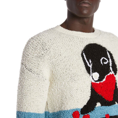 Detail of a custom alpaca sweater featuring a cartoon dog design with a red heart and chessboard, in blue and white knit.