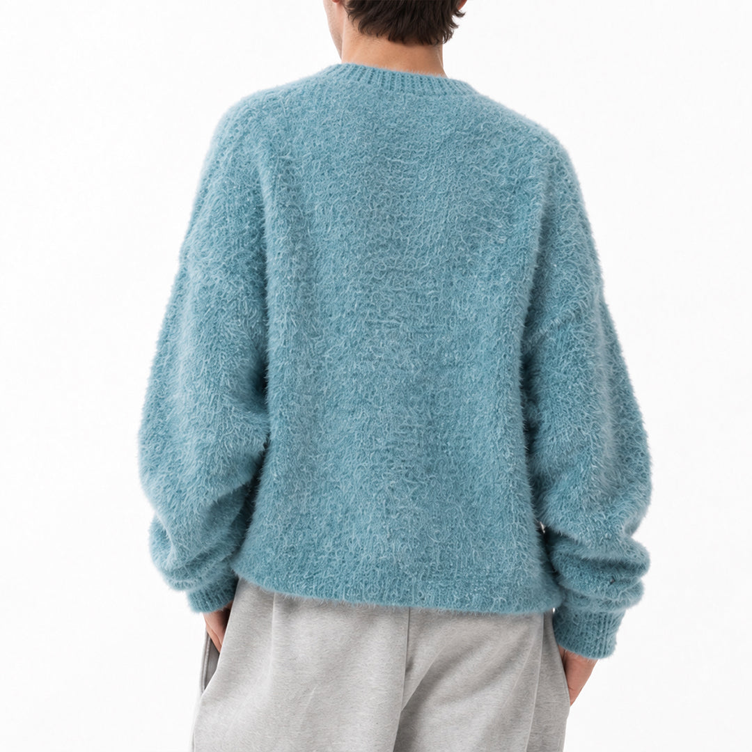 Back view of a blue knit pullover with long sleeves.