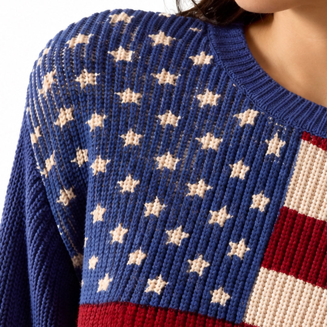 Close-up of knitted American flag sweater showing white stars on blue knit and red stripes