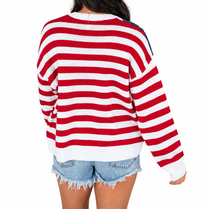 Back view of red and white striped crew neck sweater
