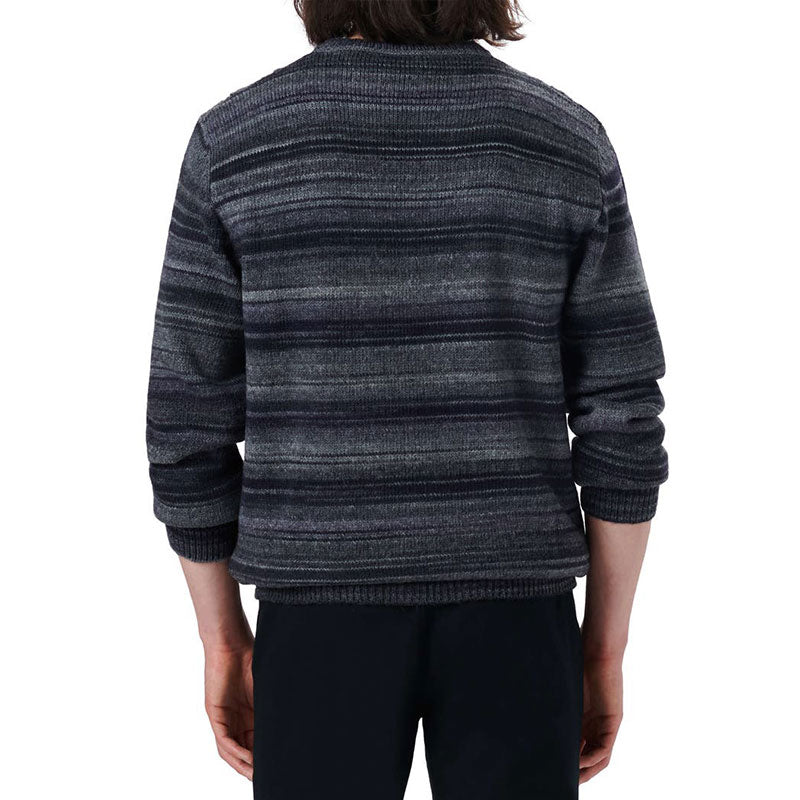 Back view of a dark wool blend striped knit sweater worn by a man, showcasing the striped design and fit.