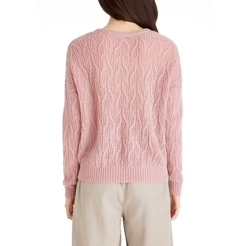 Back view of a custom wool blend cable knit sweater in pink.