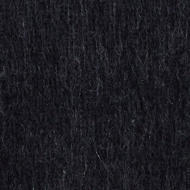 Close-up view of the mohair sweater fabric, highlighting the soft and fluffy texture of the material.