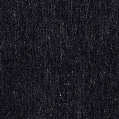 Close-up view of the mohair sweater fabric, highlighting the soft and fluffy texture of the material.