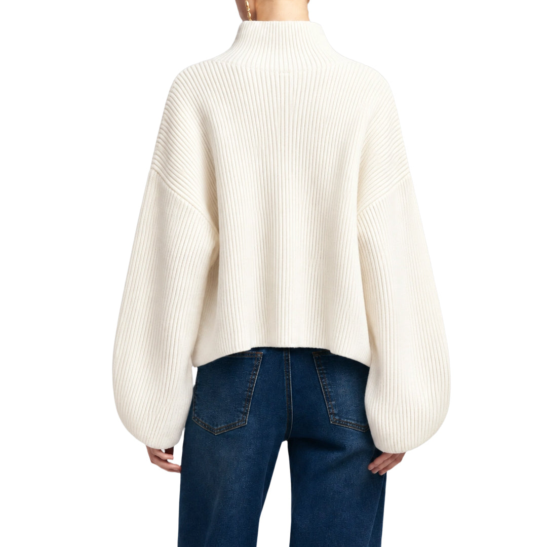 Back view of an ivory relaxed-fit knit sweater.