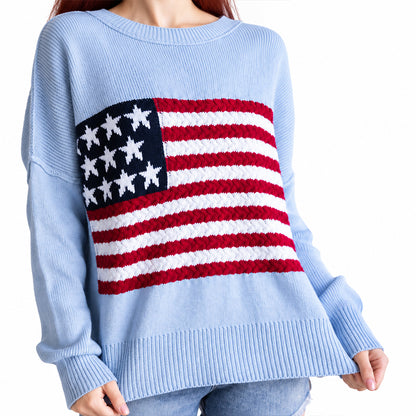 Front view of light blue knit sweater featuring a red white and blue flag motif