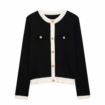 Black button-front knit cardigan with cream contrast trim and ribbed hem