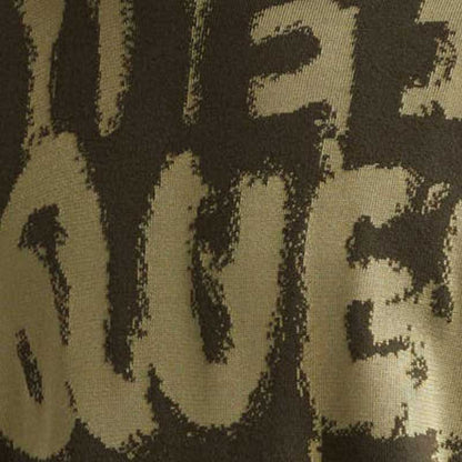 Close-up of graffiti logo design on custom wool blend knit sweater