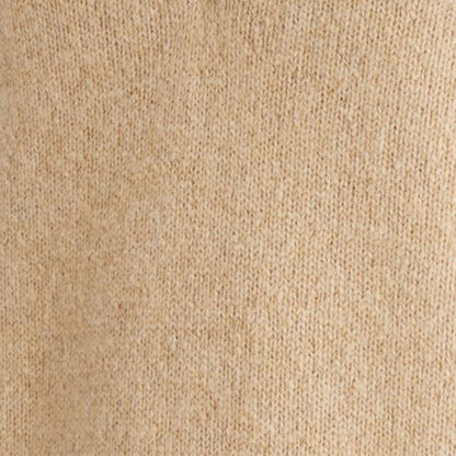 Close-up view of beige wool blend knit fabric, highlighting texture and material quality.