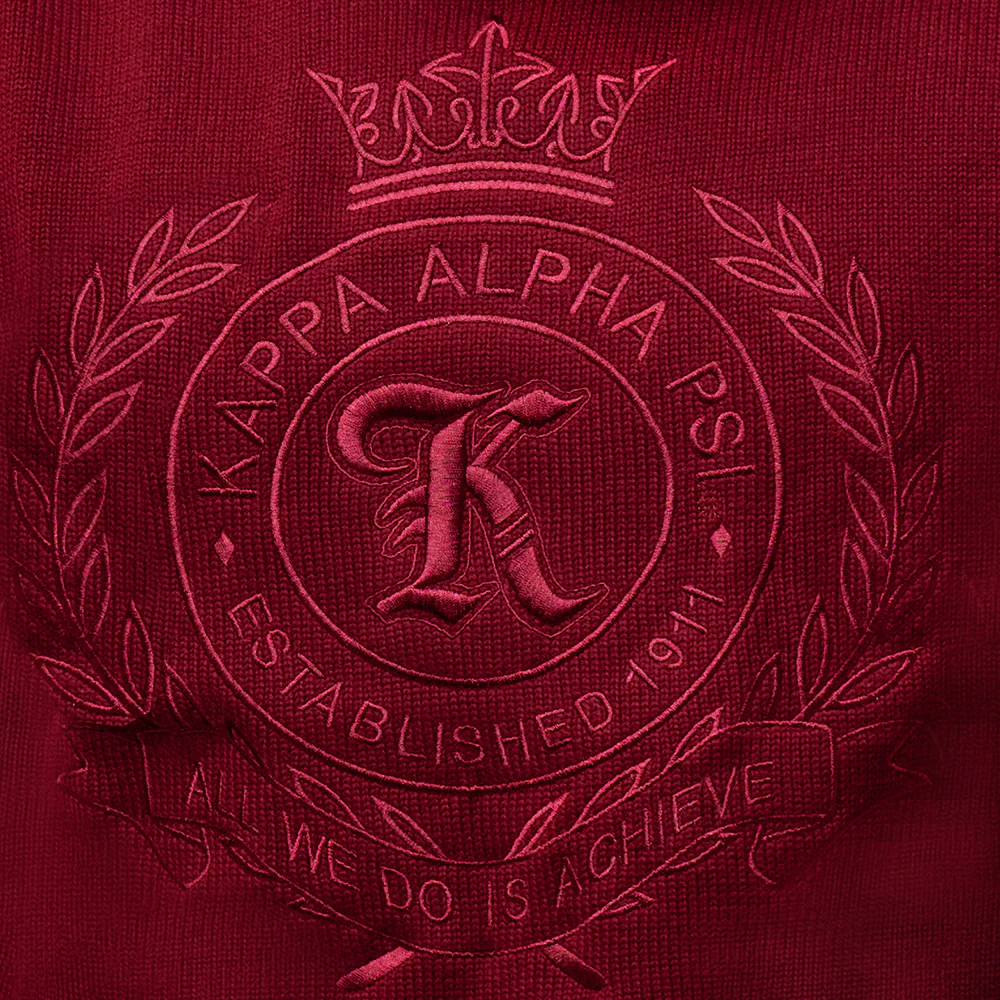 Detailed view of custom embroidered fraternity crest with Greek letters and decorative elements. Available for custom orders