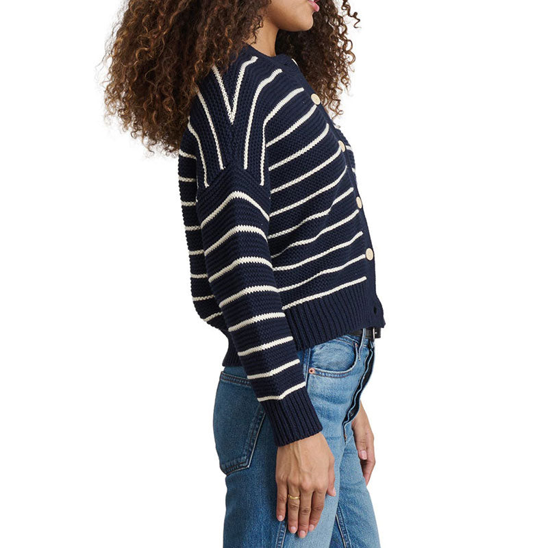 Side view of a woman in navy and white striped cardigan - custom 100% cotton knitwear.