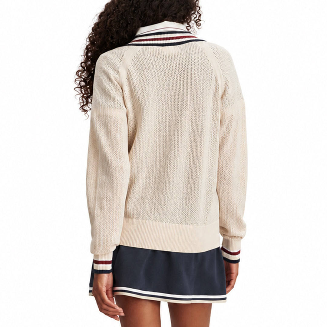 Back view of a cream women's knit sweater with ribbed hem