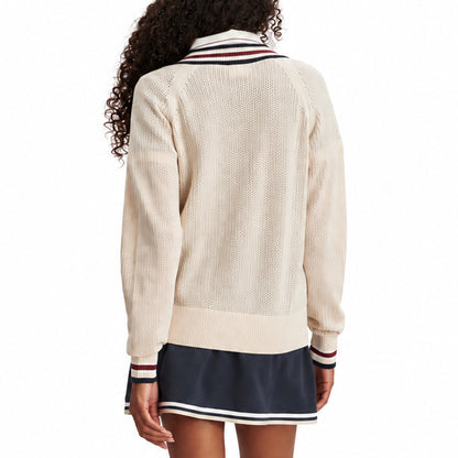 Back view of a cream women's knit sweater with ribbed hem