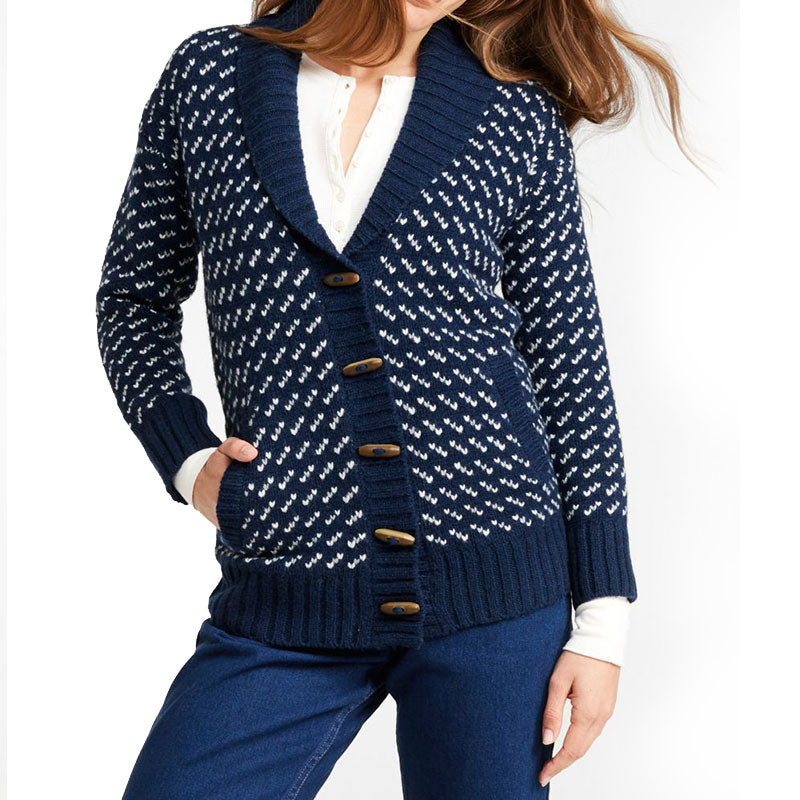 Woman wearing a navy blue wool blend knit cardigan sweater with shawl collar, ribbed cuffs and hem, and button front closure.