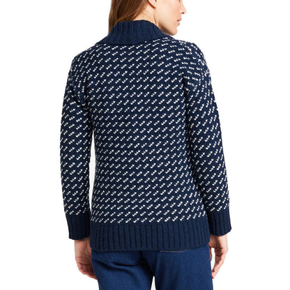 Back view of a woman wearing a navy blue wool blend knit cardigan sweater with white pattern, shawl collar, and ribbed hem.