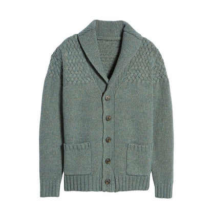 Front view of a light grey custom wool blend cardigan with pockets, button design, and textured knit pattern on the upper part.