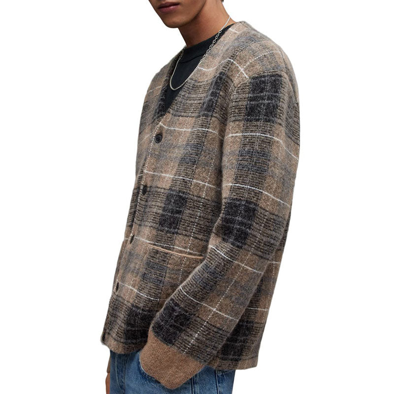 Side view of a man wearing a custom wholesale mohair blend V-neck cardigan sweater in brown plaid with blue jeans