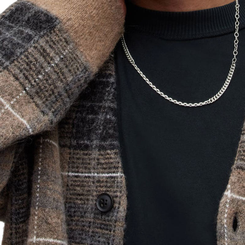 Close-up of the brown plaid fabric and button details of the custom wholesale mohair blend V-neck cardigan sweater