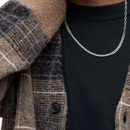 Close-up of the brown plaid fabric and button details of the custom wholesale mohair blend V-neck cardigan sweater