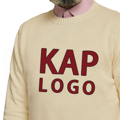 Close-up of the chest area of a custom varsity letter sweater in cream with maroon text 'KAP LOGO'.