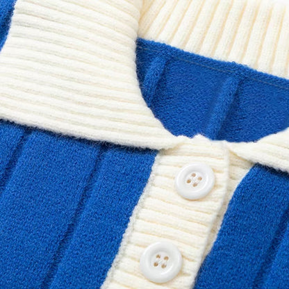 Close-up View of Blue Ribbed Varsity Knit Sweater's Collar and Buttons, Featuring a Cream Contrast Design.