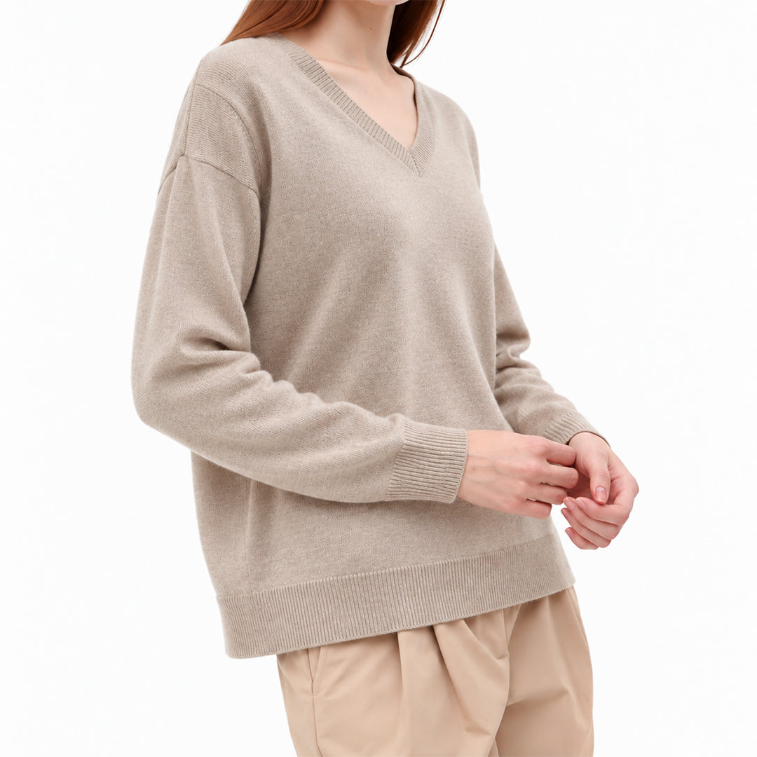 Side view of women's relaxed fit knit pullover