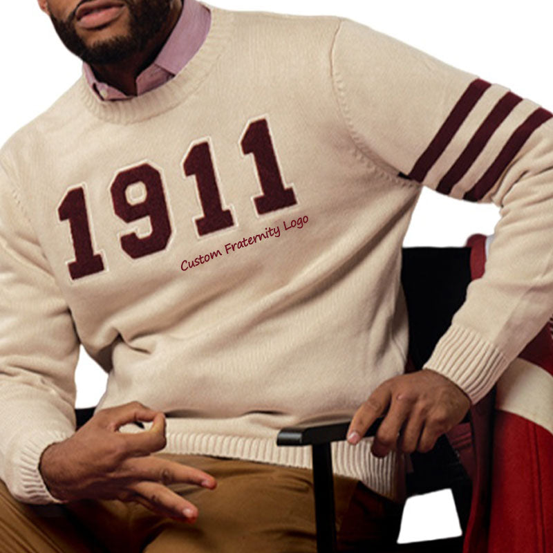 Fraternity member wearing custom 1911 logo knit sweater with maroon stripes on the sleeve. Available for group orders