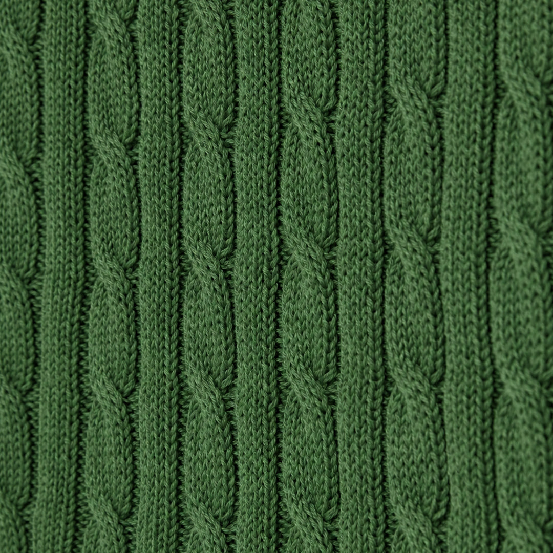 Detailed view of green cable knit stitch pattern
