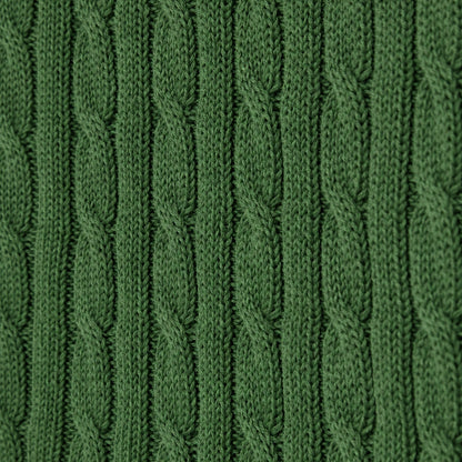 Detailed view of green cable knit stitch pattern