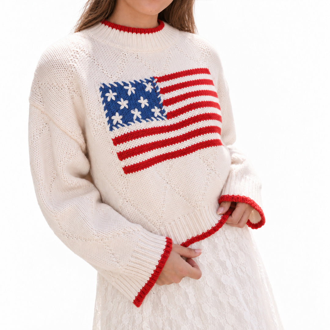 Cream pullover with American flag chest design, angled front view