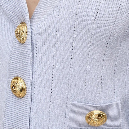 Close-up of ribbed knit texture and gold buttons