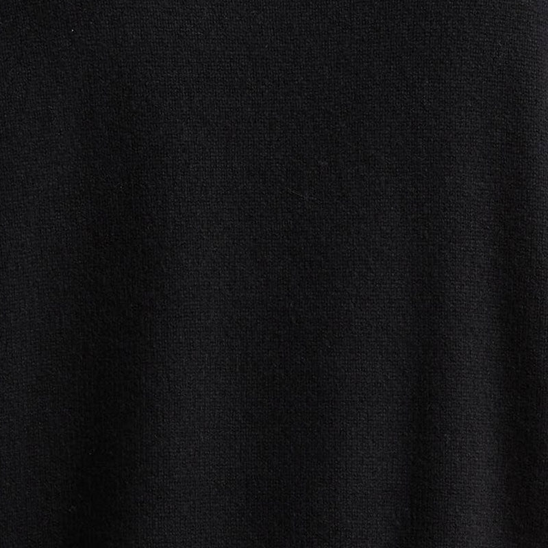 Close-up of the knit texture of a black custom logo sweater, highlighting the 100% cotton material