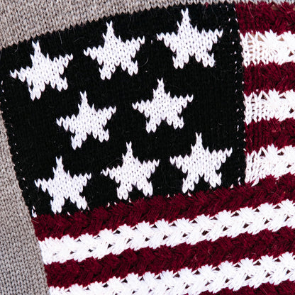 Close-up of navy star panel and red white stripes on knit fabric