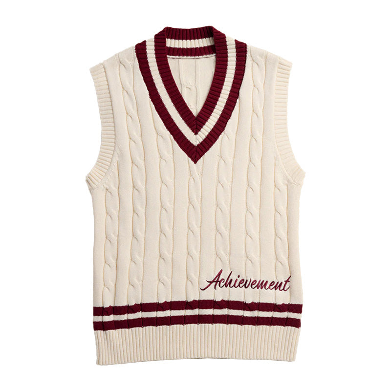 Cream cable knit vest with maroon trim and "Achievement" embroidery