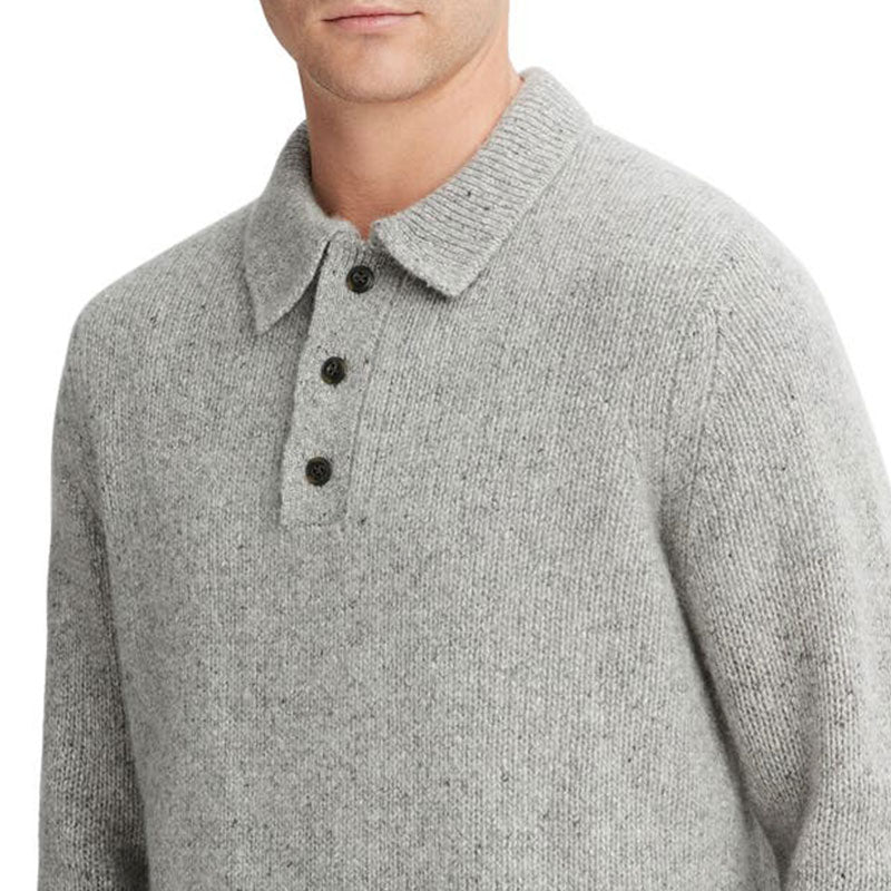 Close-up view of a gray cashmere blend knit pullover sweater with a polo collar and button placket.