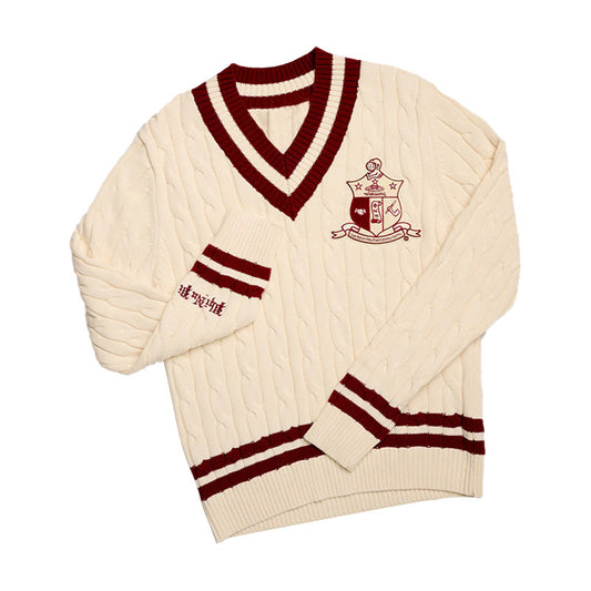 Cream cable knit sweater with maroon trim and "Kappa Alpha Psi" Logo embroidery