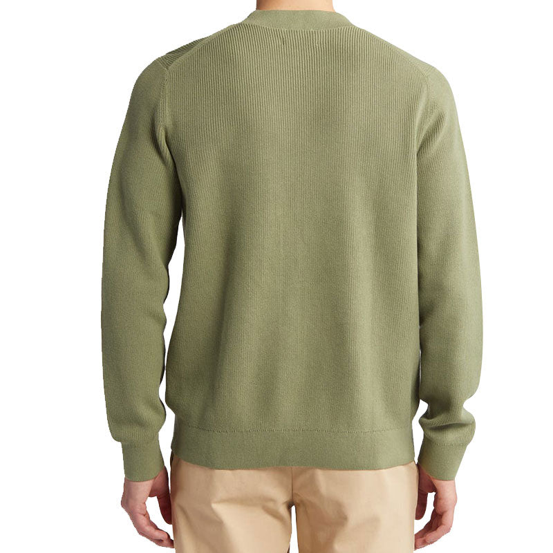 Back view of a man wearing a custom 100% cotton knit sweater in olive green, highlighting the simple and solid crew neck design.