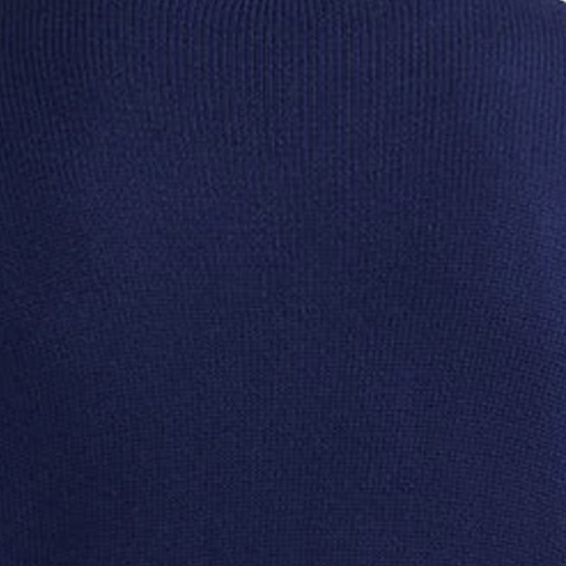 Close-up detail of the navy blue custom cashmere cardigan fabric, highlighting the fine knit texture.