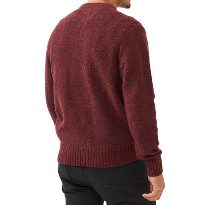 Back view of a man wearing a maroon wool blend knit sweater with ribbed cuffs and hem, highlighting the texture and fit of the sweater.