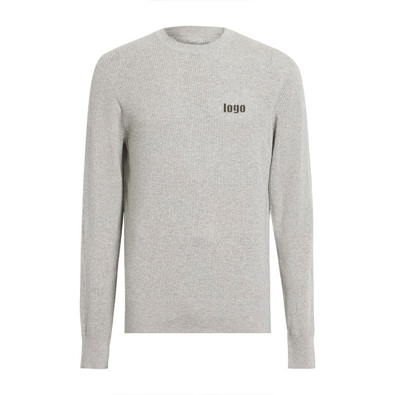 Flat lay of a light grey knit sweater made of 100% cotton, with a placeholder logo on the chest, illustrating the customizable design options.