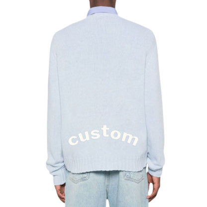 Back view of a custom light blue pullover sweater worn by a model, featuring the word "custom" on the back, suitable for OEM/ODM manufacturing.