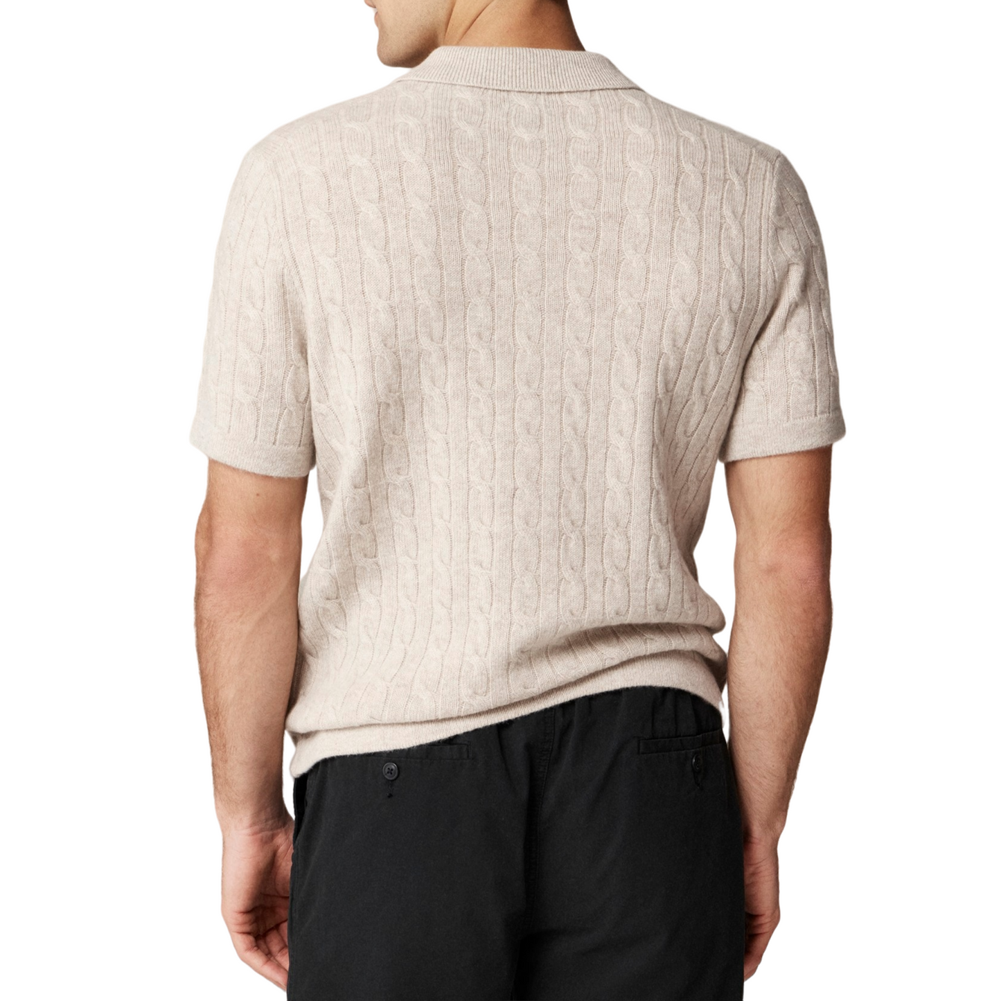 Rear view of a custom 100% cotton knit polo shirt with button cable design, worn by a model, showcasing the intricate cable pattern and short sleeves.