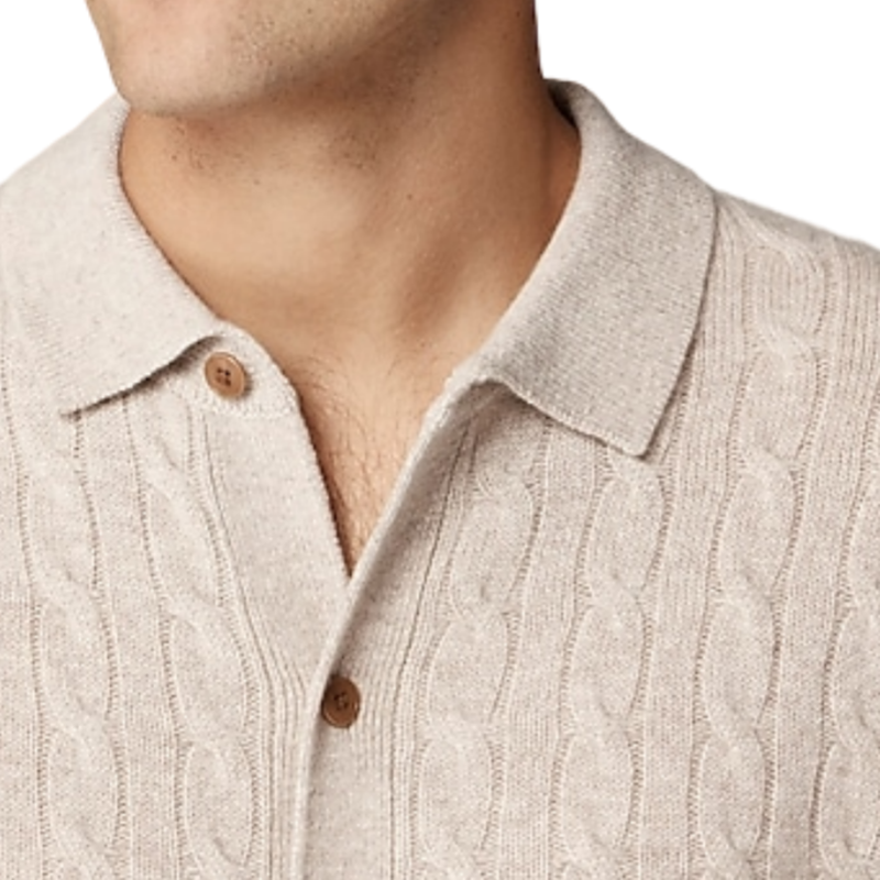 Close-up view of a custom 100% cotton knit polo shirt, highlighting the button cable design and collar detail.