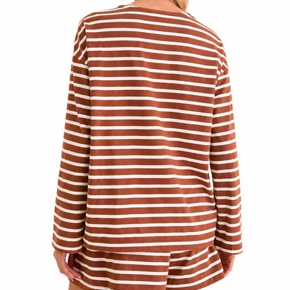 Back view of a brown and white striped long-sleeve top and matching shorts.